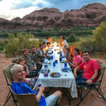 Enjoying group dinner at camp on the Colorado River