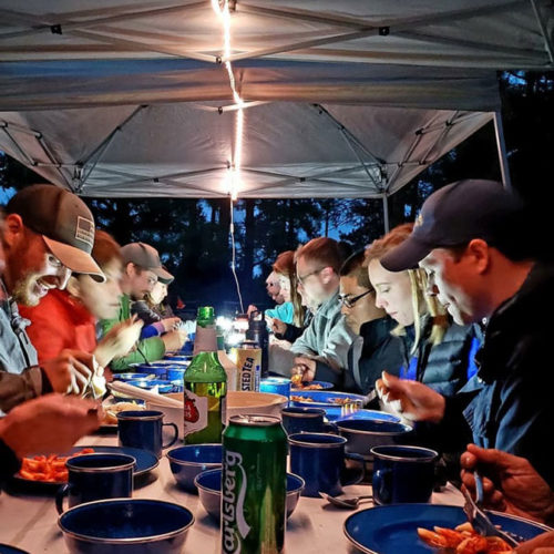 Eating dinner at camp with group