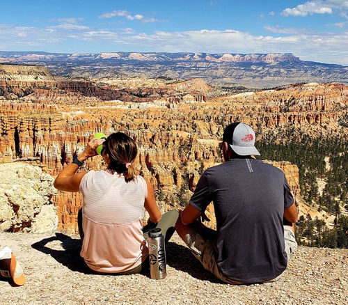 Couple resting after hiking Peekaboo Loop at Bryce