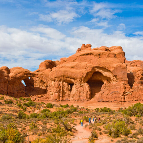 Group hiking toward Double Arch 6